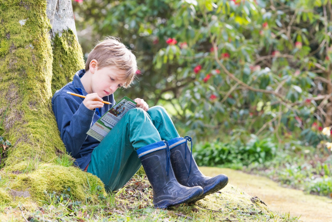 Image showing a child at Borde Hill completing the Easter trail. Image courtesy of Alex Rickard.